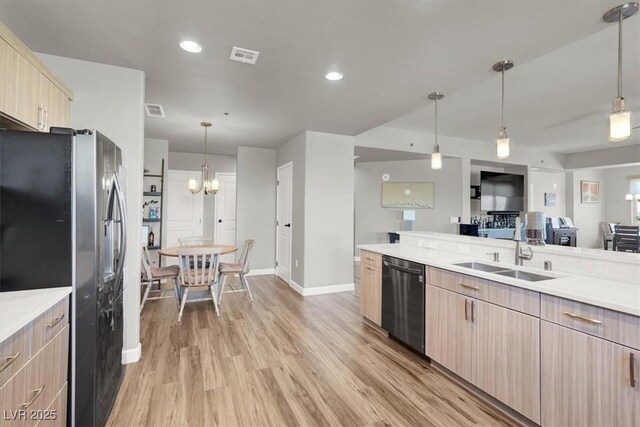 8255 Las Vegas Blvd Unit 722, Las Vegas, NV 89123 - kitchen featuring stainless steel appliances, light brown cabinetry, light countertops, open floor plan, and light wood-type flooring