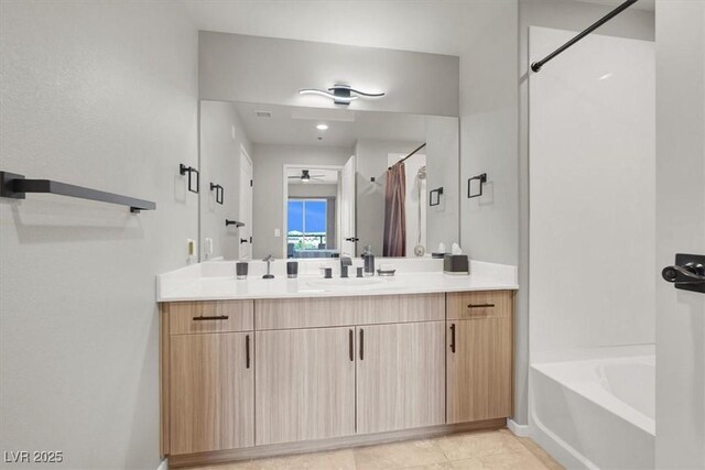 8255 Las Vegas Blvd Unit 722, Las Vegas, NV 89123 - bathroom featuring a ceiling fan, vanity, a bath, curtained shower, and tile patterned floors
