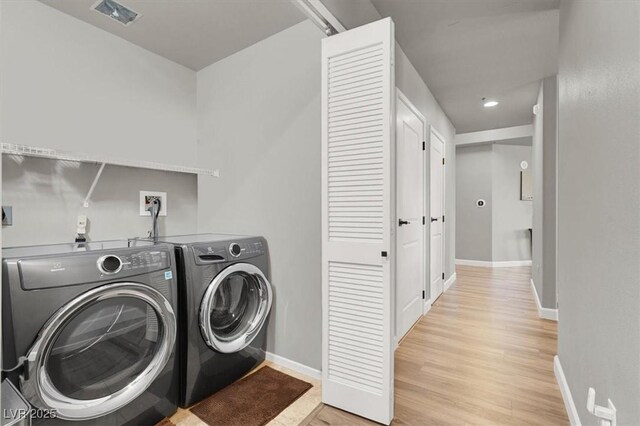 8255 Las Vegas Blvd Unit 722, Las Vegas, NV 89123 - laundry area with independent washer and dryer and light wood-type flooring