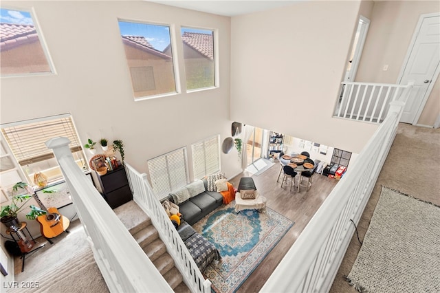 5674 Moccasin Point St, Las Vegas, NV 89148 - living room with a towering ceiling and carpet