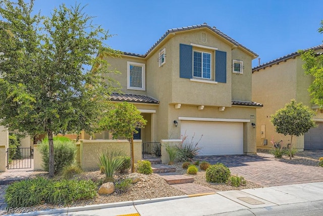 8048 Skye Bridge St, Las Vegas, NV 89166 - view of front of house with a tiled roof, a garage, a fenced front yard, decorative driveway, and stucco siding