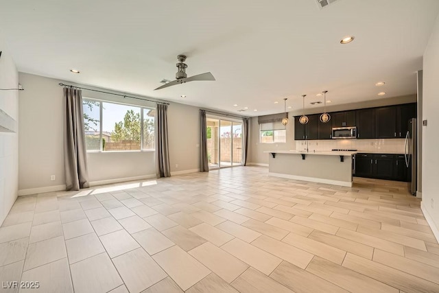 8048 Skye Bridge St, Las Vegas, NV 89166 - unfurnished living room with ceiling fan, recessed lighting, and light tile patterned floors