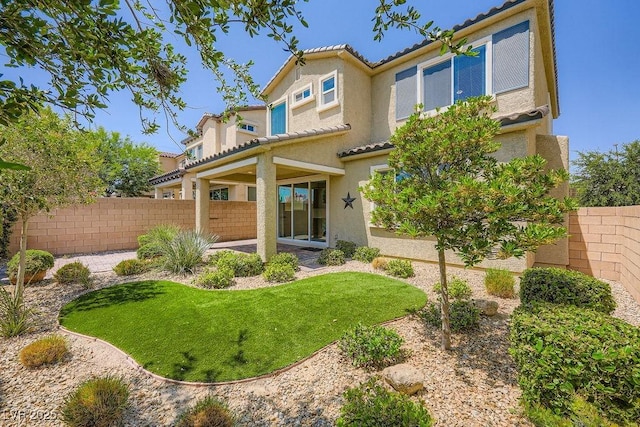 8048 Skye Bridge St, Las Vegas, NV 89166 - rear view of property featuring stucco siding, a tiled roof, and a patio