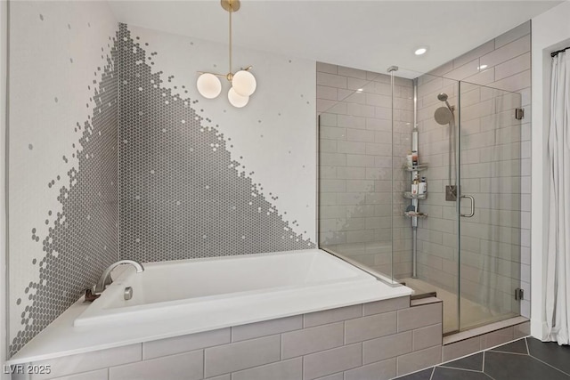 9789 Twilight Moon Ave, Las Vegas, NV 89148 - bathroom featuring a shower stall, a garden tub, and tile patterned flooring