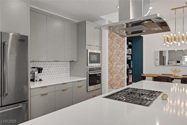 9789 Twilight Moon Ave, Las Vegas, NV 89148 - kitchen with stainless steel appliances, gray cabinetry, island exhaust hood, decorative backsplash, and light countertops