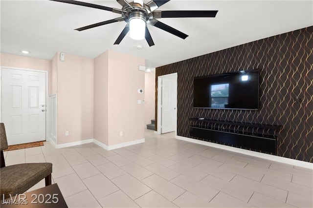 11755 Garland Grove Ln, Las Vegas, NV 89183 - unfurnished living room with an accent wall, a ceiling fan, and recessed lighting