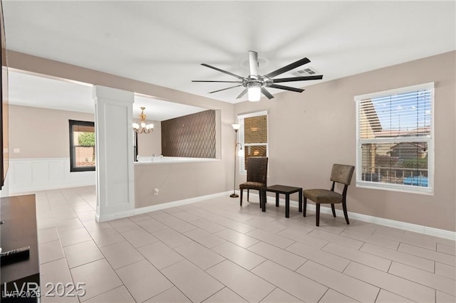 11755 Garland Grove Ln, Las Vegas, NV 89183 - sitting room with a chandelier, a ceiling fan, and light tile patterned flooring