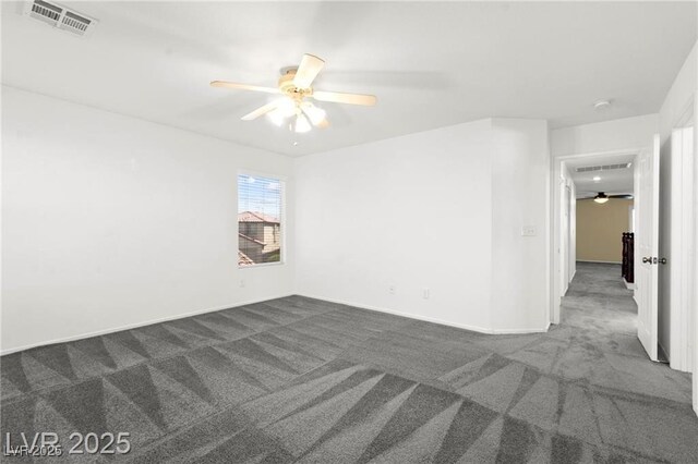 11755 Garland Grove Ln, Las Vegas, NV 89183 - empty room with dark colored carpet, a ceiling fan, and a smoke detector