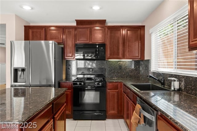 11755 Garland Grove Ln, Las Vegas, NV 89183 - kitchen with black appliances, tasteful backsplash, dark stone counters, light tile patterned floors, and recessed lighting