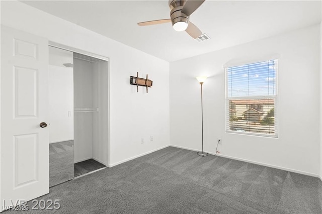 11755 Garland Grove Ln, Las Vegas, NV 89183 - unfurnished bedroom featuring dark colored carpet, a closet, and a ceiling fan