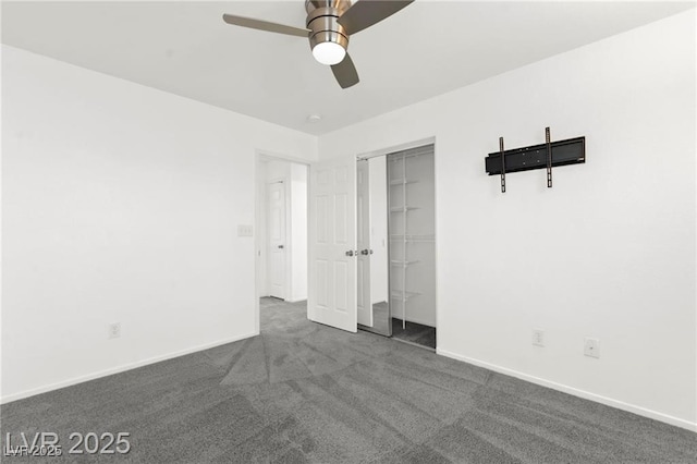 11755 Garland Grove Ln, Las Vegas, NV 89183 - unfurnished bedroom with dark colored carpet, a closet, and a ceiling fan