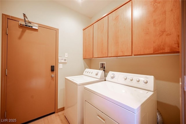 15 Emerald Dunes Cir, Henderson, NV 89052 - laundry room with cabinet space, washing machine and clothes dryer, and light wood finished floors