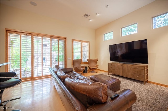 15 Emerald Dunes Cir, Henderson, NV 89052 - living room featuring light wood-style floors and a towering ceiling