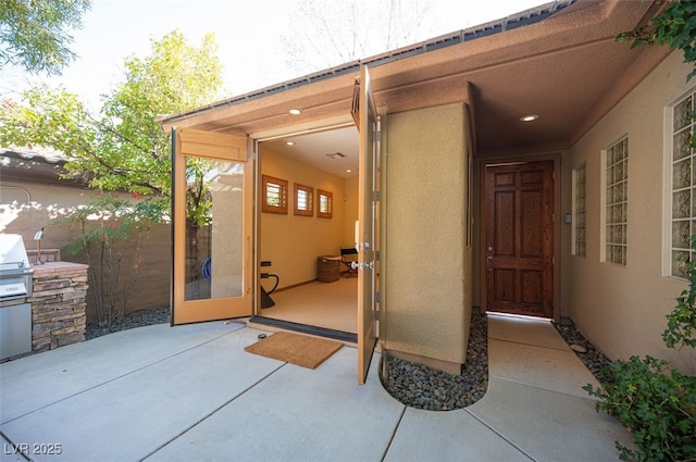 15 Emerald Dunes Cir, Henderson, NV 89052 - property entrance featuring stucco siding and a patio