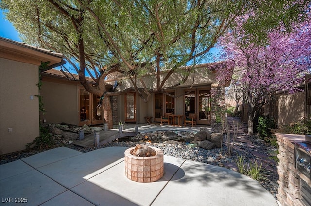 15 Emerald Dunes Cir, Henderson, NV 89052 - view of patio / terrace with an outdoor fire pit
