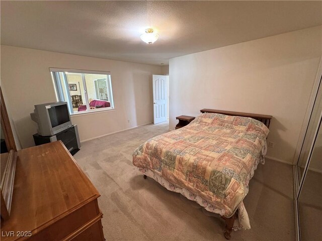 3110 National Ave, Pahrump, NV 89048 - bedroom featuring light carpet and baseboards