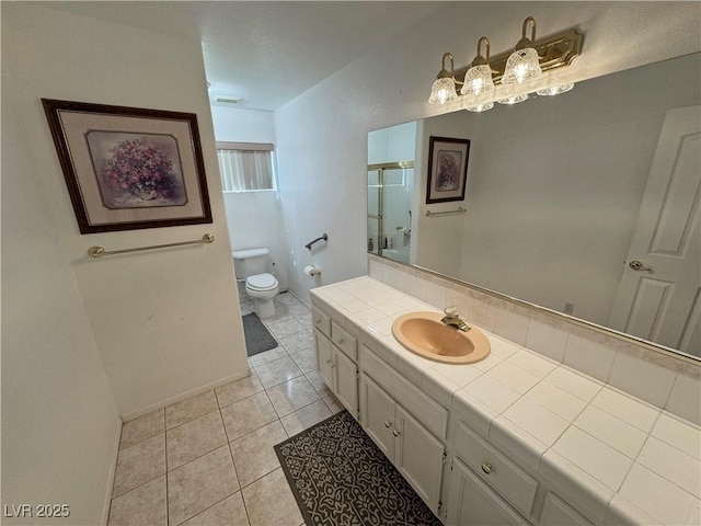 3110 National Ave, Pahrump, NV 89048 - bathroom with tile patterned floors, vanity, and an enclosed shower