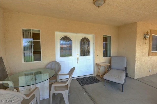 3110 National Ave, Pahrump, NV 89048 - entrance to property with stucco siding, outdoor dining area, and a patio area