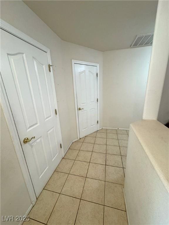 3110 National Ave, Pahrump, NV 89048 - corridor featuring light tile patterned floors and baseboards