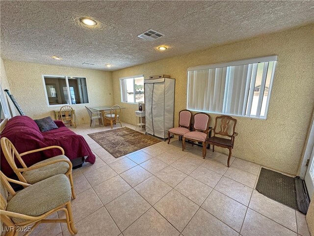 3110 National Ave, Pahrump, NV 89048 - sitting room featuring a textured wall, a textured ceiling, and light tile patterned floors