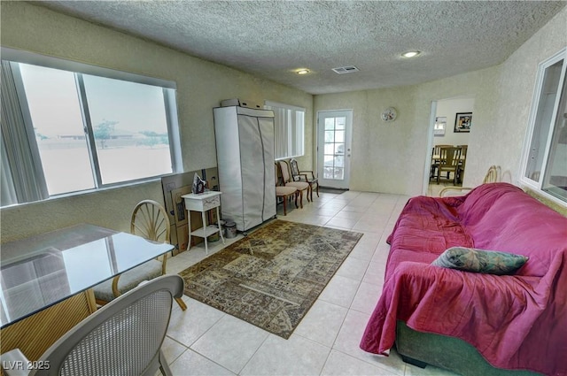 3110 National Ave, Pahrump, NV 89048 - tiled living room with a textured ceiling and recessed lighting