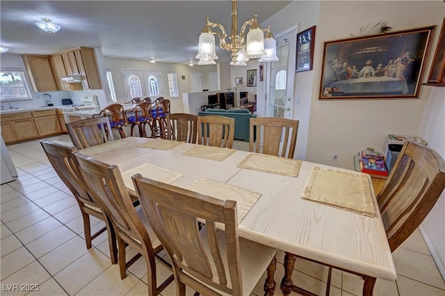 3110 National Ave, Pahrump, NV 89048 - dining area with light tile patterned floors, a chandelier, and plenty of natural light