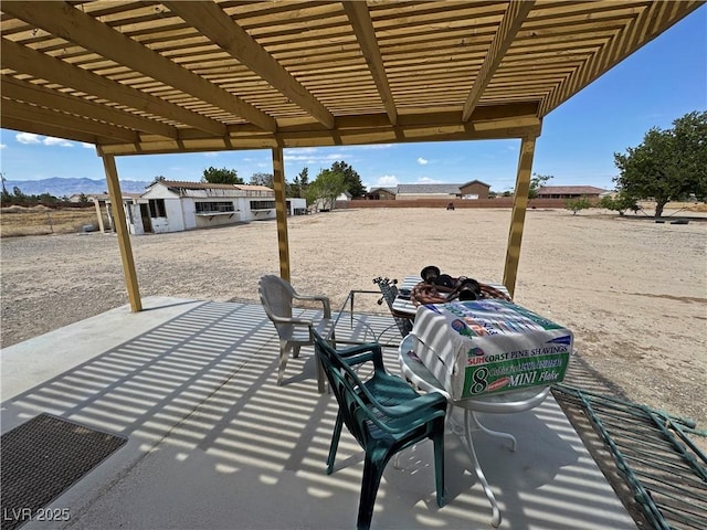 3110 National Ave, Pahrump, NV 89048 - view of patio / terrace featuring a pergola and a mountain view