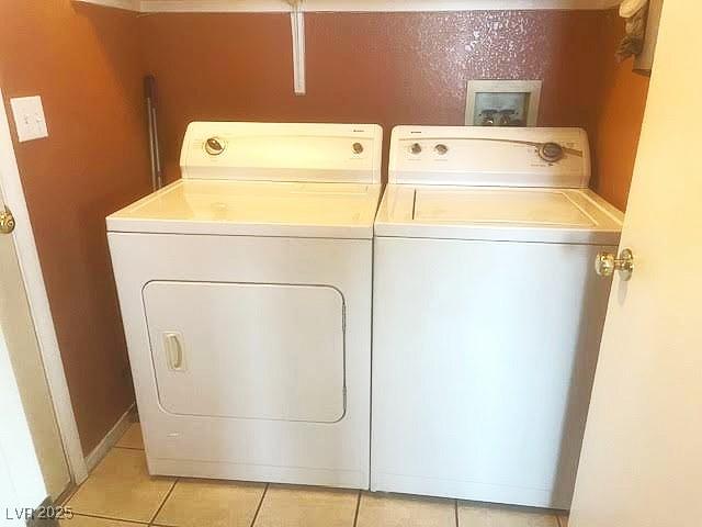 4314 Flaming Ridge Trl, Las Vegas, NV 89147 - laundry area featuring washer and clothes dryer and light tile patterned flooring