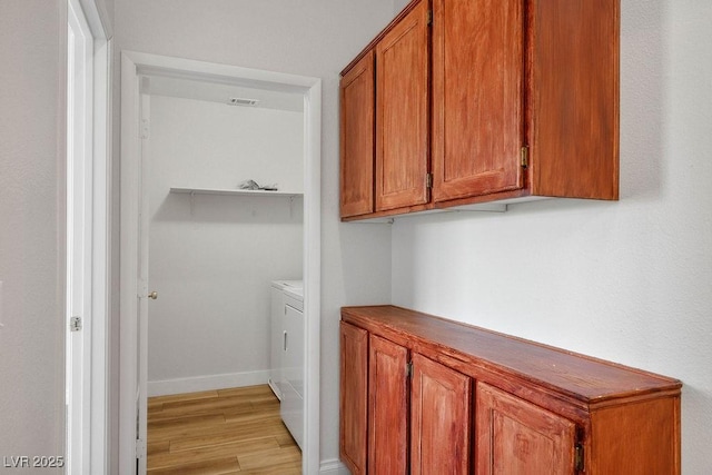 901 Nevada Sky St, Las Vegas, NV 89128 - laundry room with washing machine and clothes dryer and light wood finished floors