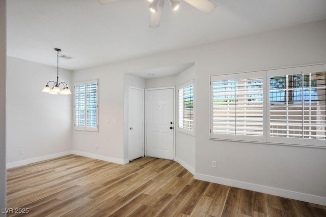 901 Nevada Sky St, Las Vegas, NV 89128 - entryway featuring a ceiling fan, healthy amount of natural light, wood finished floors, and a chandelier