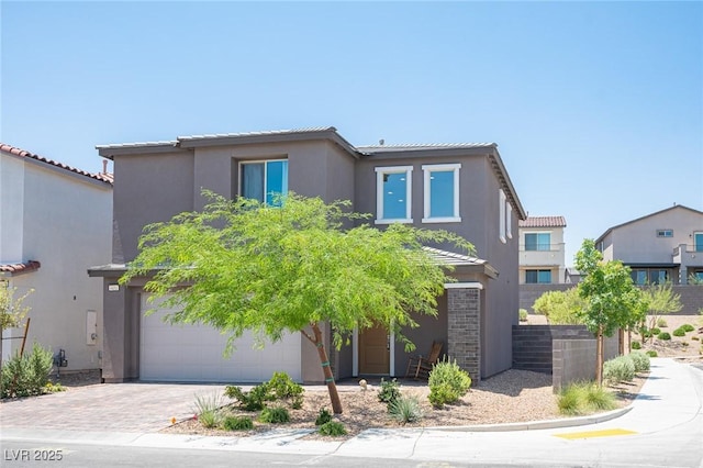 9451 Lunar Ray St, Las Vegas, NV 89143 - view of front facade featuring stucco siding, driveway, a garage, and a tiled roof