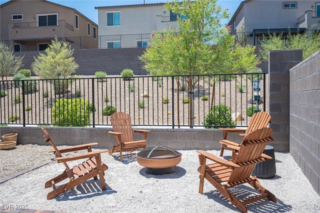 9451 Lunar Ray St, Las Vegas, NV 89143 - view of patio / terrace with a fire pit