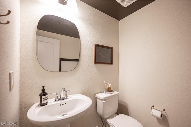 9451 Lunar Ray St, Las Vegas, NV 89143 - half bath with a sink and toilet