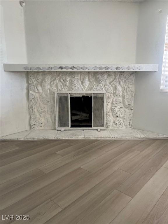 901 Sulphur Springs Ln Unit 101, Las Vegas, NV 89128 - detailed view of a fireplace and wood finished floors