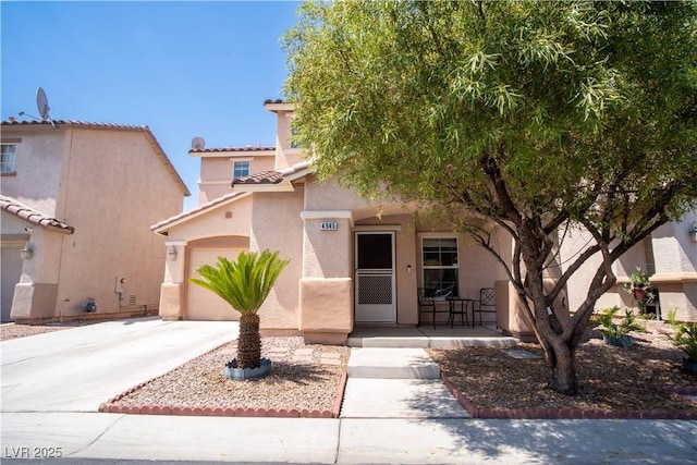 4945 Volcanic Rock Ln, Las Vegas, NV 89122 - view of front of property with stucco siding, concrete driveway, and a porch