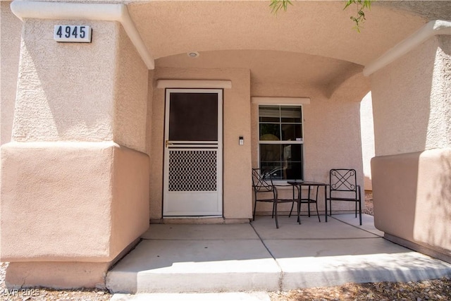 4945 Volcanic Rock Ln, Las Vegas, NV 89122 - entrance to property featuring stucco siding and a patio
