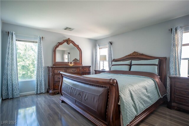 4945 Volcanic Rock Ln, Las Vegas, NV 89122 - bedroom with multiple windows and wood finished floors