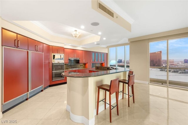 2747 Paradise Rd Unit 2704, Las Vegas, NV 89109 - kitchen with stainless steel appliances, ornamental molding, dark countertops, recessed lighting, and backsplash