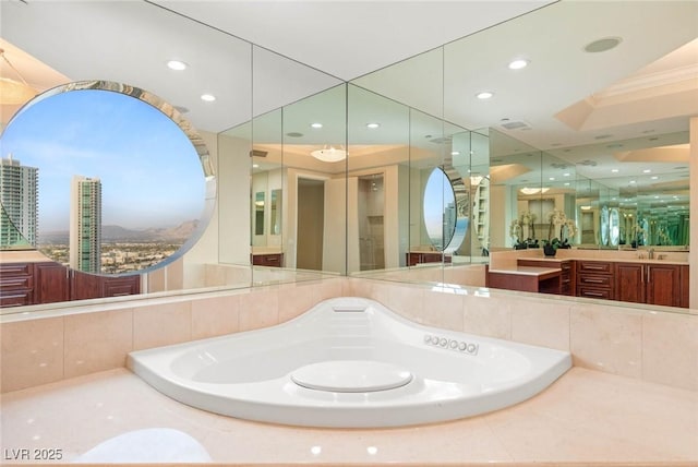 2747 Paradise Rd Unit 2704, Las Vegas, NV 89109 - full bathroom with a garden tub, vanity, and recessed lighting