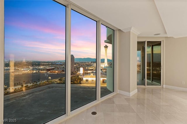 2747 Paradise Rd Unit 2704, Las Vegas, NV 89109 - empty room with tile patterned floors and expansive windows