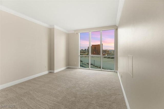 2747 Paradise Rd Unit 2704, Las Vegas, NV 89109 - spare room with crown molding and carpet floors