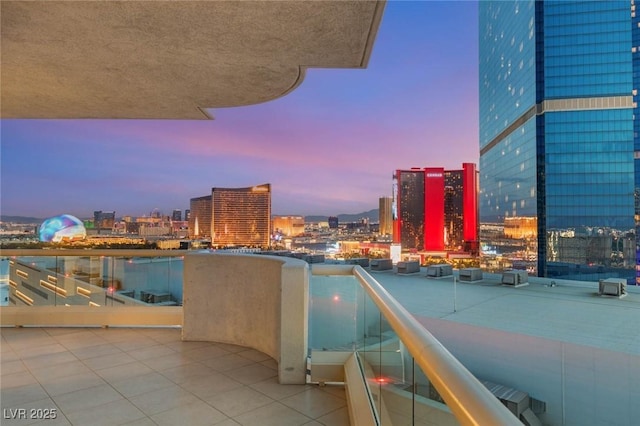 2747 Paradise Rd Unit 2704, Las Vegas, NV 89109 - balcony at dusk featuring a city view