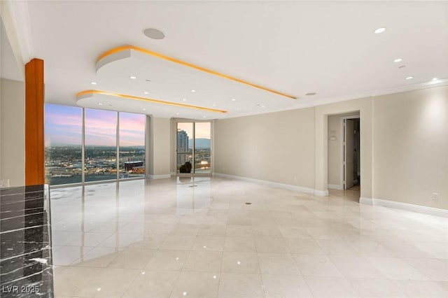 2747 Paradise Rd Unit 2704, Las Vegas, NV 89109 - spare room with light tile patterned floors, expansive windows, recessed lighting, and ornamental molding