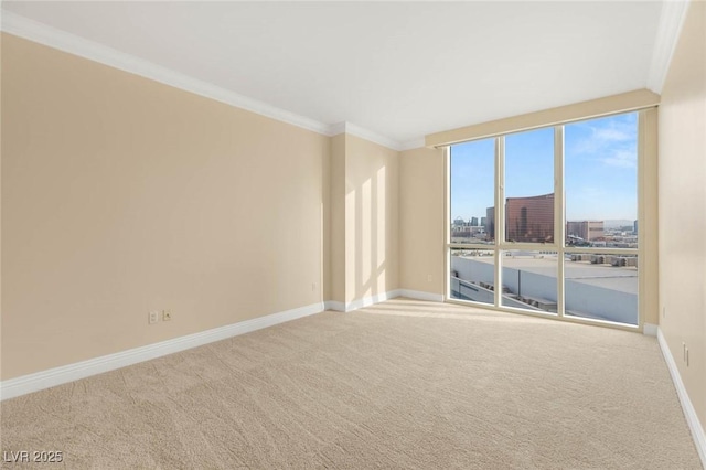 2747 Paradise Rd Unit 2704, Las Vegas, NV 89109 - carpeted empty room featuring crown molding and a city view