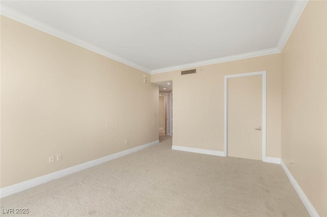 2747 Paradise Rd Unit 2704, Las Vegas, NV 89109 - spare room with crown molding and light carpet