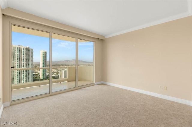 2747 Paradise Rd Unit 2704, Las Vegas, NV 89109 - spare room featuring carpet and a mountain view