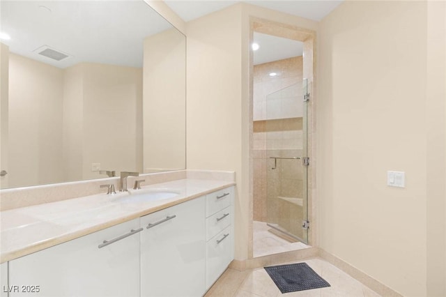 2747 Paradise Rd Unit 2704, Las Vegas, NV 89109 - bathroom with vanity, a stall shower, tile patterned flooring, and recessed lighting