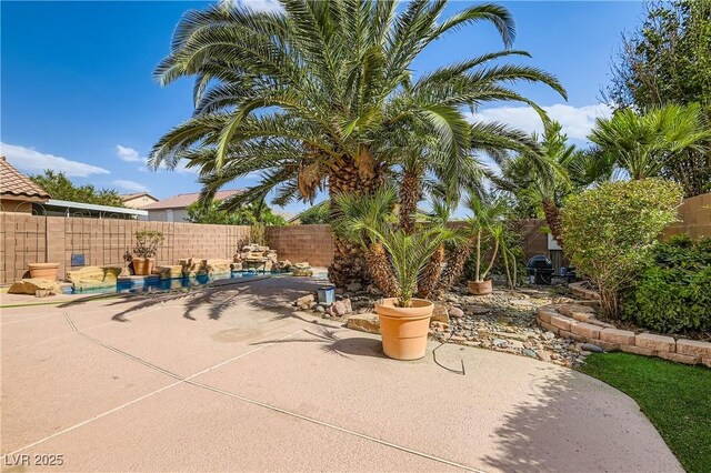 5021 Ropers Rock Ct, Las Vegas, NV 89131 - fenced backyard with a patio