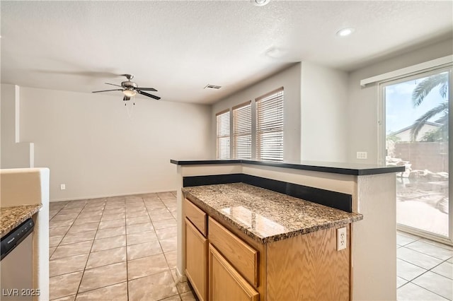 5021 Ropers Rock Ct, Las Vegas, NV 89131 - kitchen with stainless steel dishwasher, a ceiling fan, healthy amount of natural light, light tile patterned floors, and recessed lighting