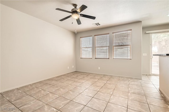 5021 Ropers Rock Ct, Las Vegas, NV 89131 - spare room with light tile patterned flooring, healthy amount of natural light, and ceiling fan